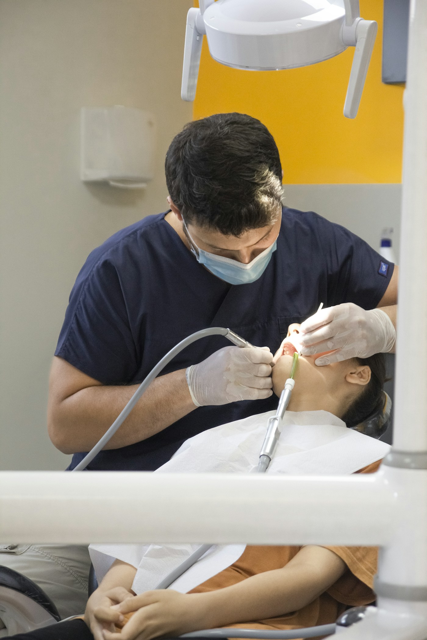 Illustrative stock photograph of a dentist providing care to a patient